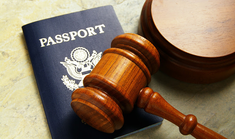 US passport and judges court gavel, from above