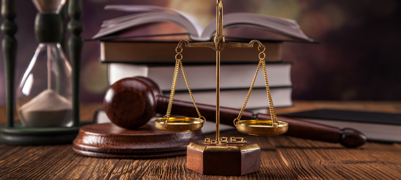 Mallet, legal code and scales of justice. Law concept, studio shots
