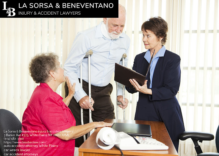 Injured man and his wife meet with a personal injury lawyer.
