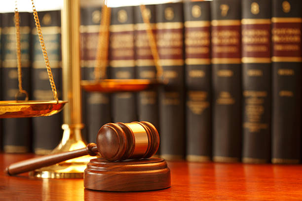 Gavel And Scales Of Justice On Desk In Law Office