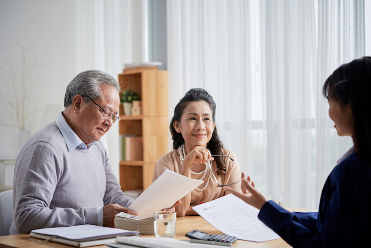 Asian aged couple meeting with