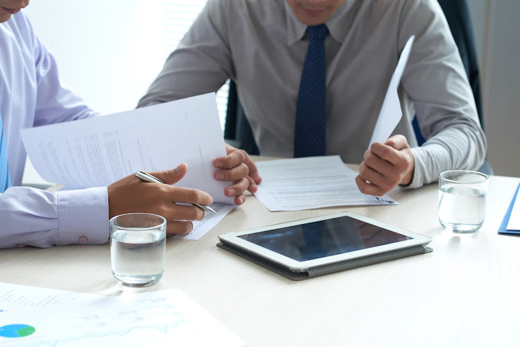 Cropped image of lawyers checking business contracts