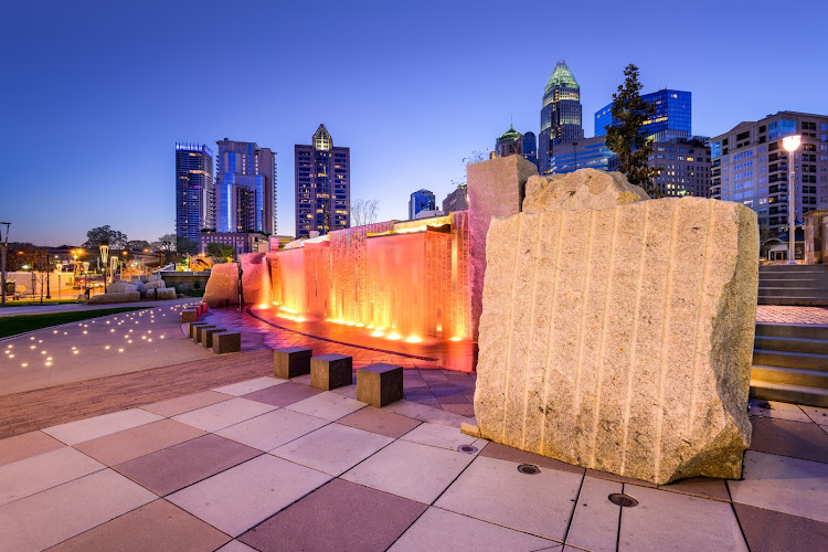 Charlotte, North Carolina, USA uptown skyline and park.