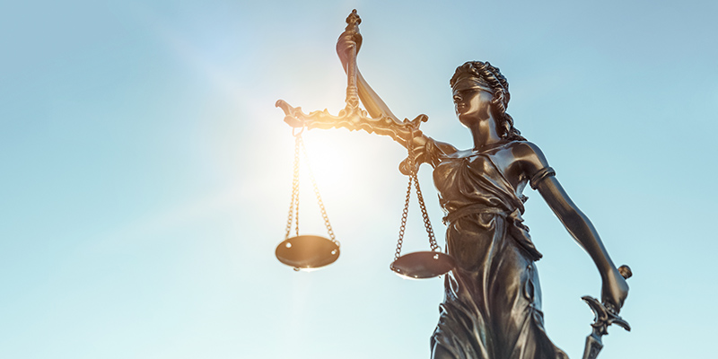 Lady justice. Statue of Justice on sky background. Legal and law concept